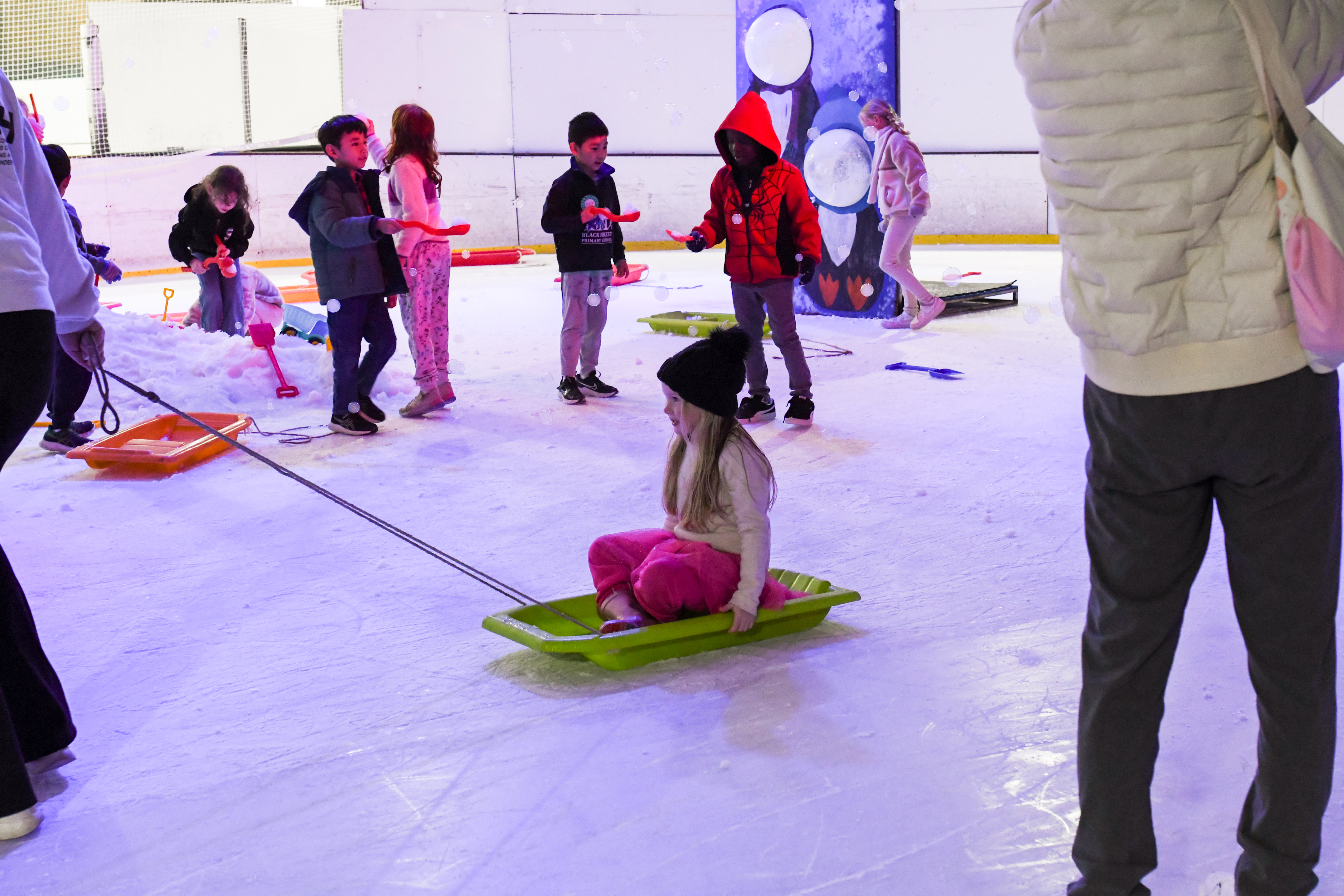 Children enjoying a birthday party on the ice