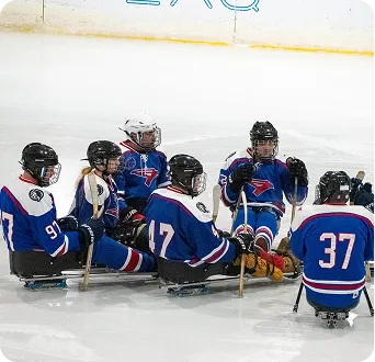 Para ice hockey participants on the ice