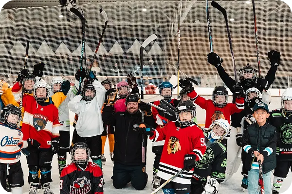 Children enjoying a group ice skating session
